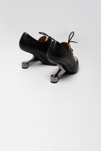 Richelieux à talon sculptural United Nude bicolore noir et beige seconde main 